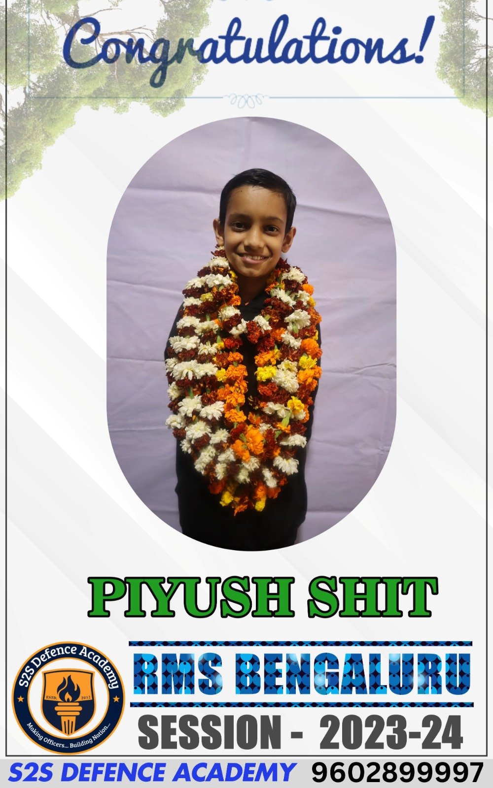 The image shows a congratulatory poster featuring a young boy named "piyush shit" adorned with garlands of marigold and other flowers. The background is light with tree branches on the top edges. A message at the top reads "Congratulations!" in a decorative font. At the bottom, it says "PIYUSH SHIT" in large green text, followed by "RMS DHOLPUR" in bold blue, and "SESSION - 2023-24." A circular emblem on the lower left corner shows the "S2S Defence Academy" logo with the slogan "Making Officers... Building Nation."