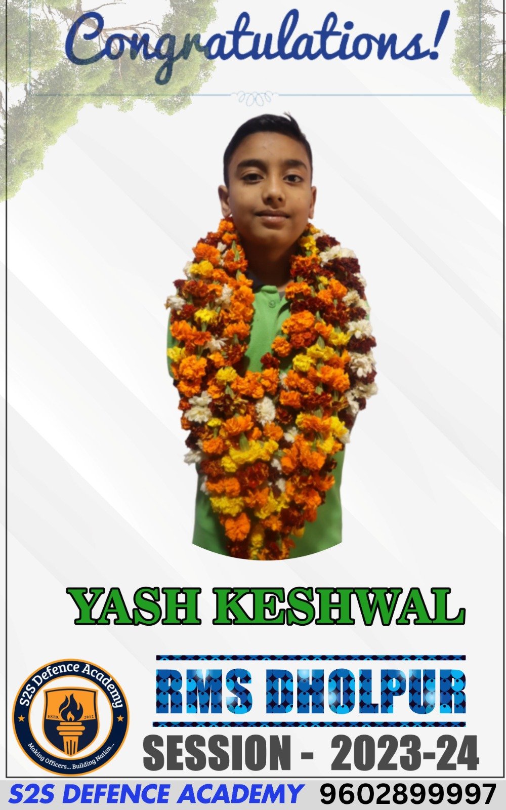The image shows a congratulatory poster featuring a young boy named "Yash Keshwal" adorned with garlands of marigold and other flowers. The background is light with tree branches on the top edges. A message at the top reads "Congratulations!" in a decorative font. At the bottom, it says "YASH KESHWAL" in large green text, followed by "RMS DHOLPUR" in bold blue, and "SESSION - 2023-24." A circular emblem on the lower left corner shows the "S2S Defence Academy" logo with the slogan "Making Officers... Building Nation."